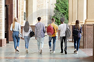 Group of students walking in college campus after classes