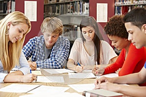 Group of students working together in library