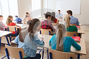 Group of students writing school test