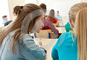 Group of students writing school test