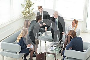 A group of successful business people. Discussion of the importa