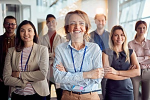 Group of successful business people, multiethnic employees workers pose at workplace