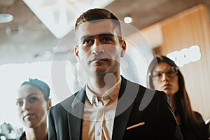 Group of successful business people standing together at office.