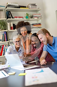 Group of successful happy multiethnic business people working as a team in office on meeting.