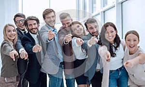 group of successful young people pointing at you