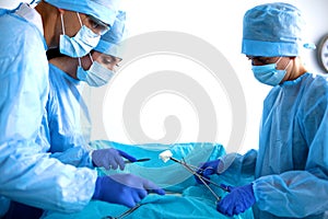 Group of surgeon at work in operating theatre
