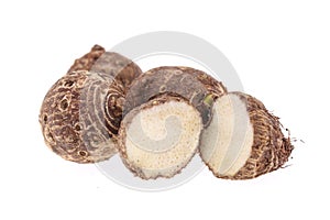 Group of sweet taro root isolated on white background arbi or Aravi roots with one cut in cross sections