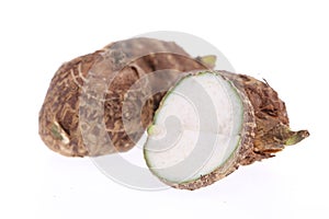 Group of sweet taro root isolated on white background arbi or Aravi roots with one cut in cross sections