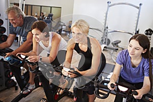 Group Taking Spin Class In Gym