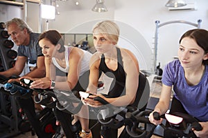 Group Taking Spin Class In Gym