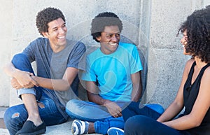 Group of talking african american and caribbean friends