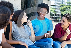 Group of talking african american and latin and caucasian people