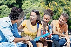 Group of talking international male and female students