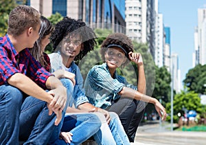 Group of talking young adults in the city