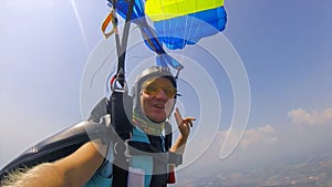 Group. A team of parachutists performs tricks in the air. Sky dancing. Free fall.