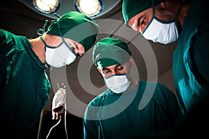 Group and teamwork of surgeons in the hospital operating room.