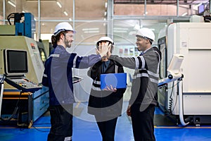 Group of technicians engineers team working at industrial factory