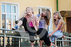 Group of teen girls calling on the mobile phones