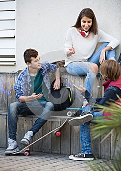 Group of teenage friends chatting and having fun