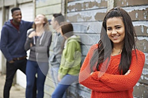 Group Of Teenage Friends Hanging Out In Urban Setting