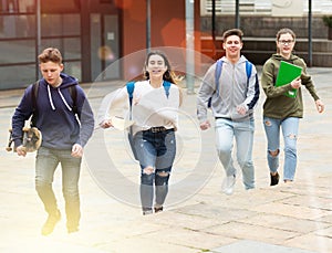 Teenager school kids running