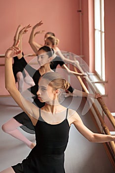 Group of teenage girls practicing classical ballet