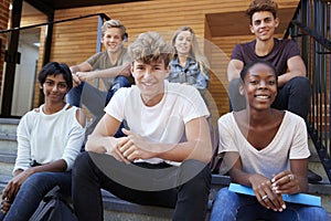 Group Of Teenage Students Socialising On College Campus Together