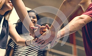 Group of teenager friends on a basketball court teamwork and togetherness concept