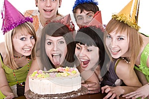 Group of teenagers celebrate happy birthday.