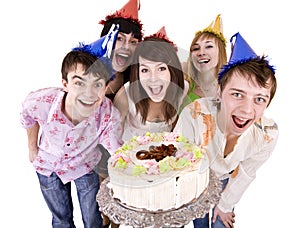 Group of teenagers celebrate happy birthday.