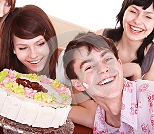 Group of teenagers celebrate happy birthday.