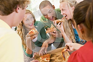 Group Of Teenagers Eating Pizza