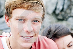 Group of teenagers hanging out outdoors -portrait of boy