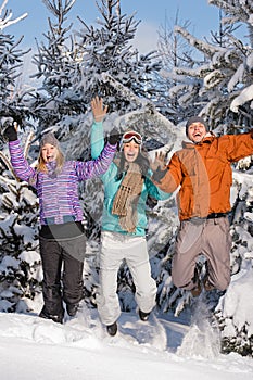 Group of teenagers jumping together in wintertime