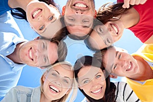 Group of teenagers looking down