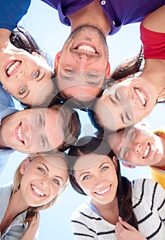 Group of teenagers looking down