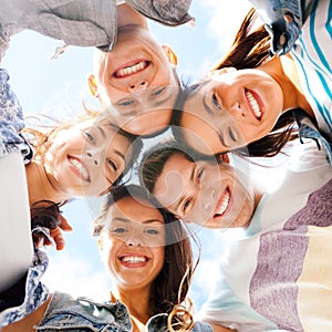 Group of teenagers looking down