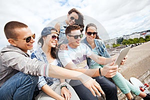 Group of teenagers looking at tablet pc