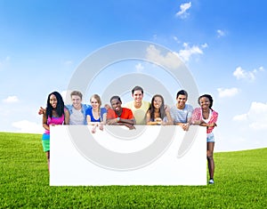 Group of teenagers posing with a white board