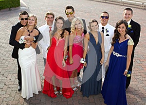 A Group of Teenagers at the Prom posing for a photo