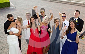 A Group of Teenagers at the Prom posing for a photo