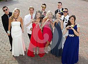 A Group of Teenagers at the Prom posing for a photo