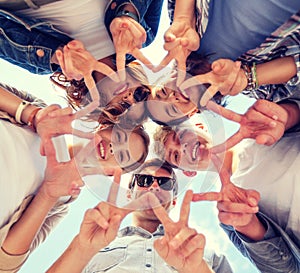 Group of teenagers showing finger five