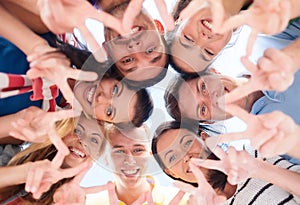 Group of teenagers showing finger five gesture