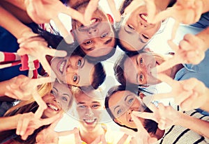 Group of teenagers showing finger five gesture