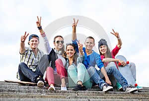 Group of teenagers showing finger five