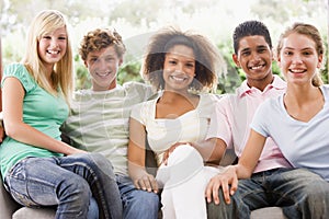 Group Of Teenagers Sitting On A Couch photo