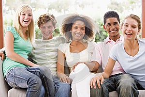 Group Of Teenagers Sitting On A Couch