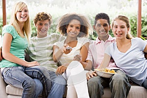 Group Of Teenagers Sitting On A Couch