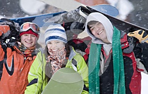 Group of teenagers snowborders